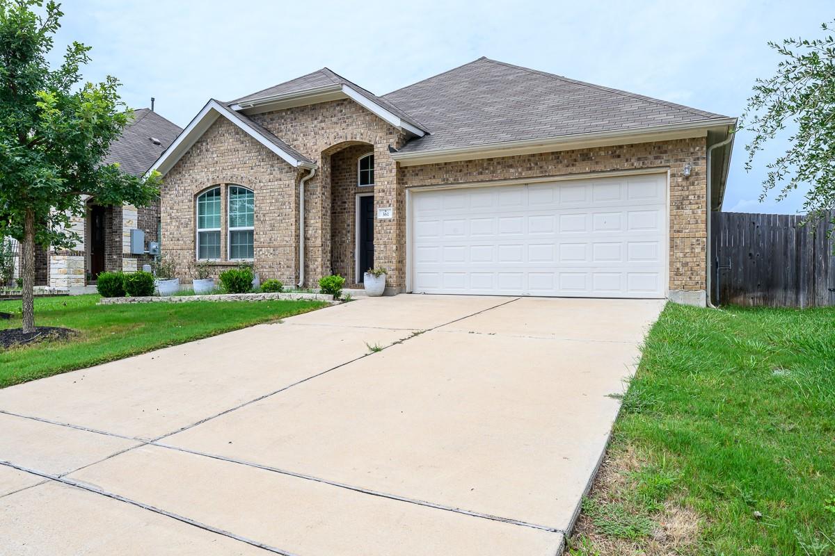 Brick facade with an inviting arched entry and a 