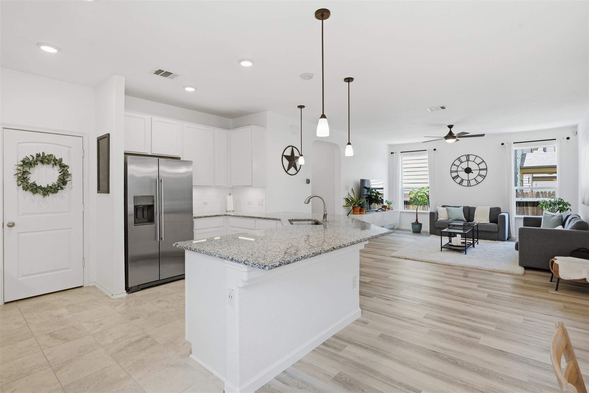 An open concept design seamlessly connects the ki