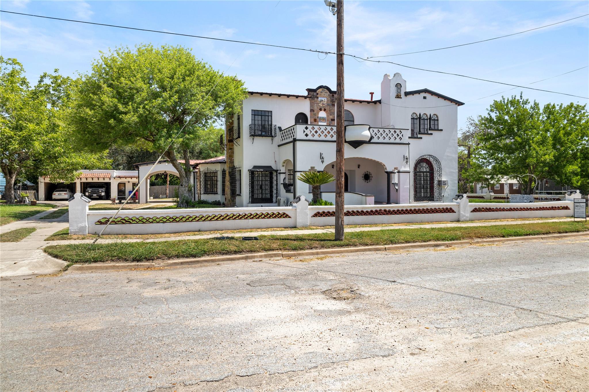 A charming stucco facade with Spanish-inspired ar