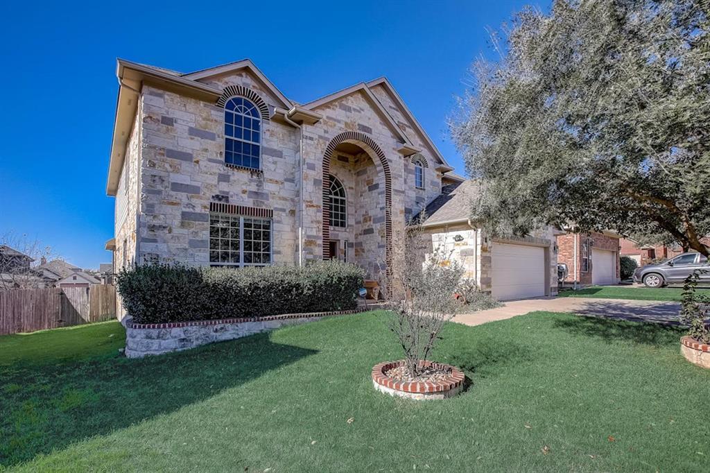 A grand stone facade with arched entryways and a 