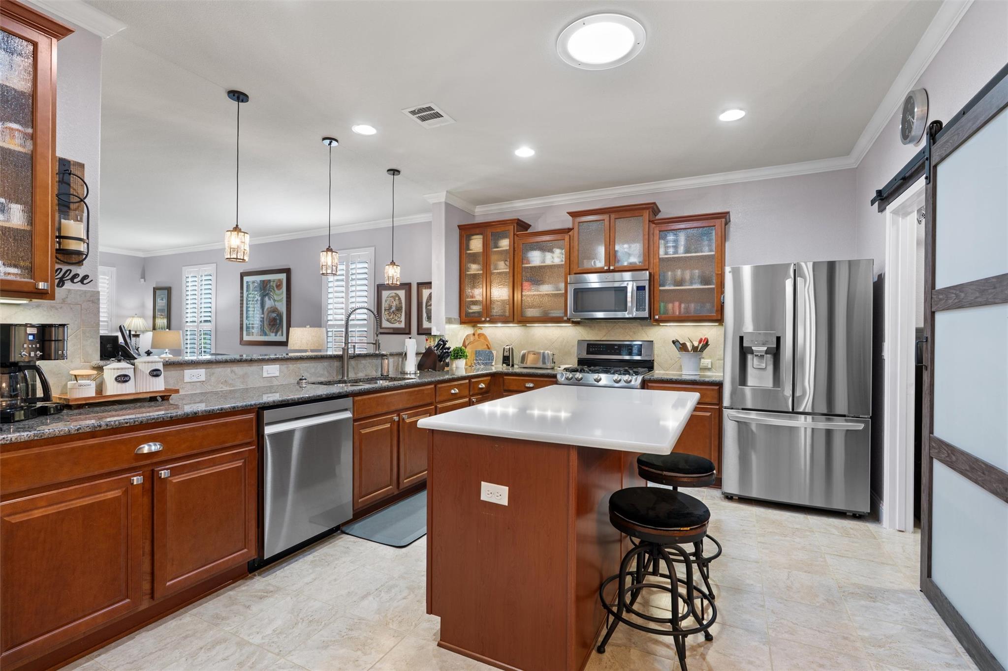A well-appointed kitchen features rich wood cabin