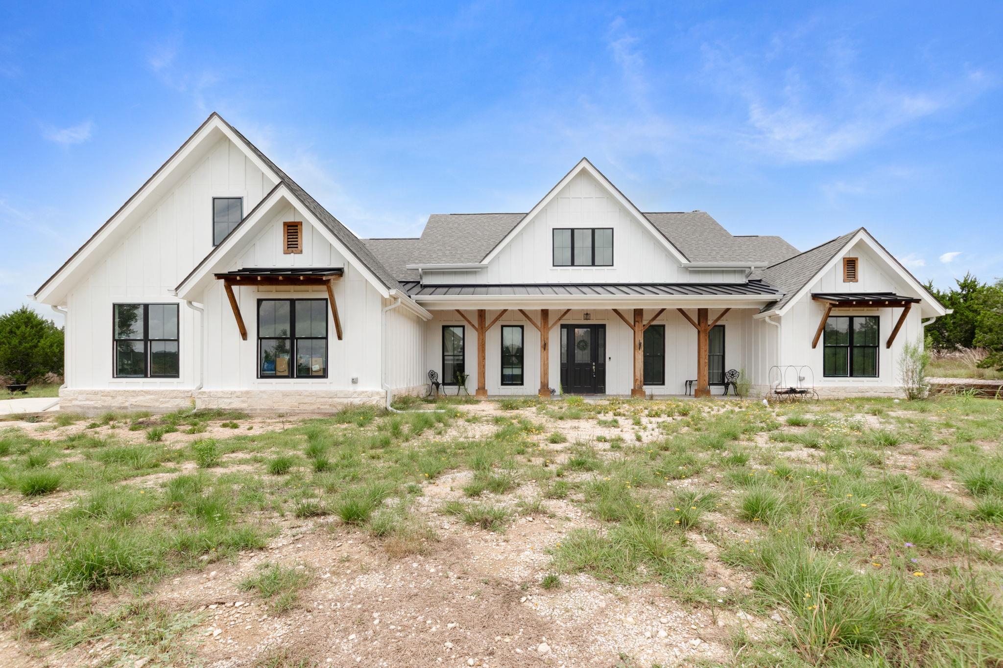 A striking modern farmhouse facade with board and