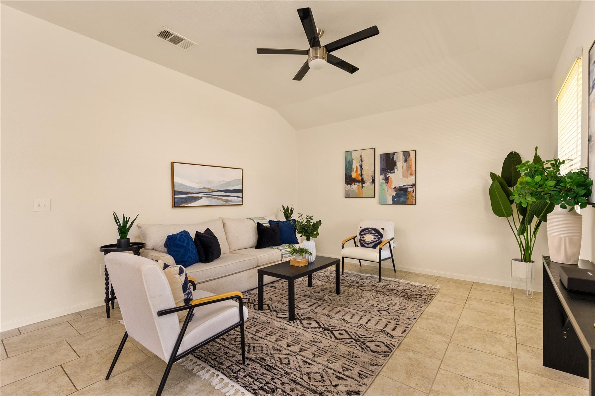 A well-lit living area offers comfortable loungin