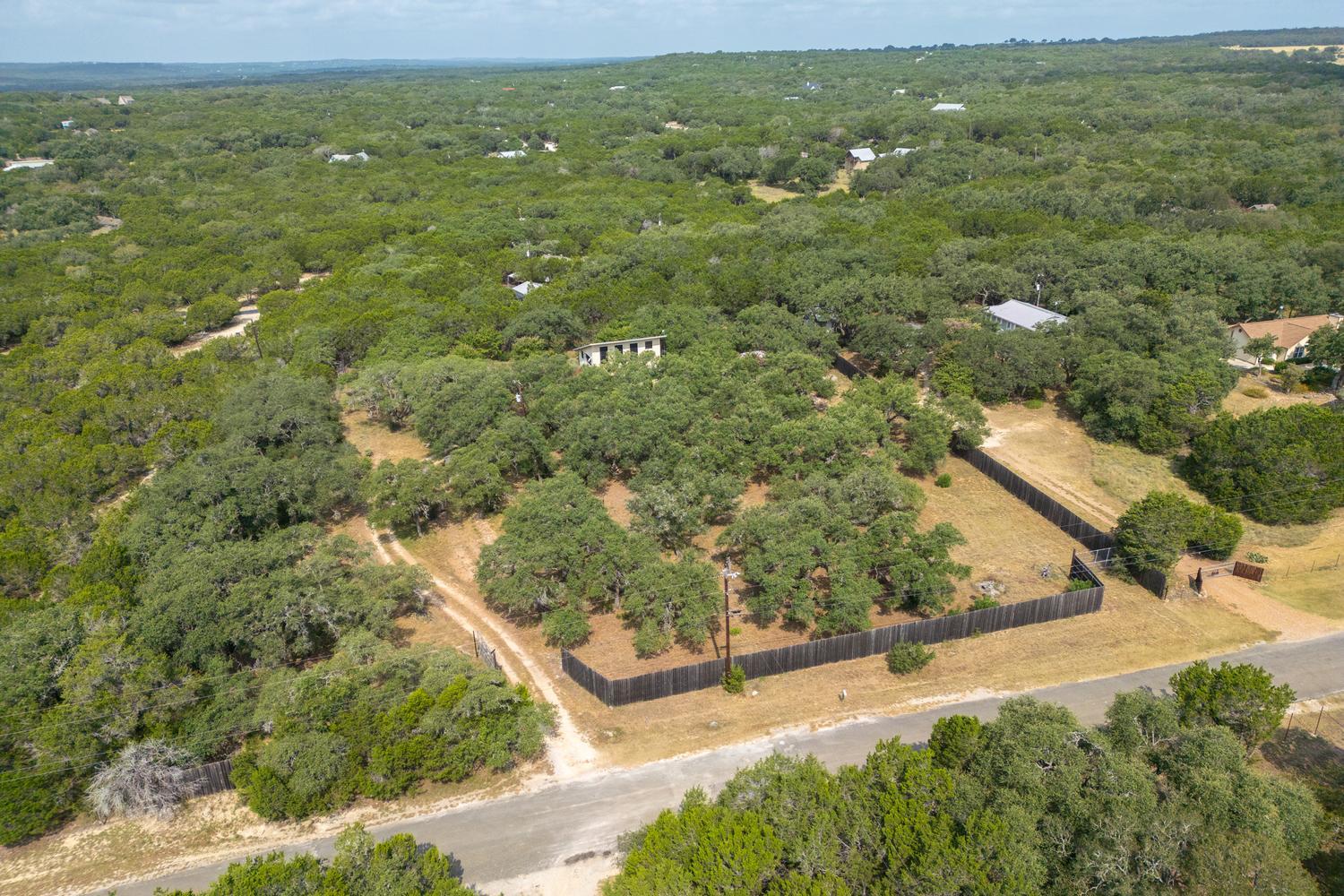 Vast acreage surrounded by mature trees offers a 