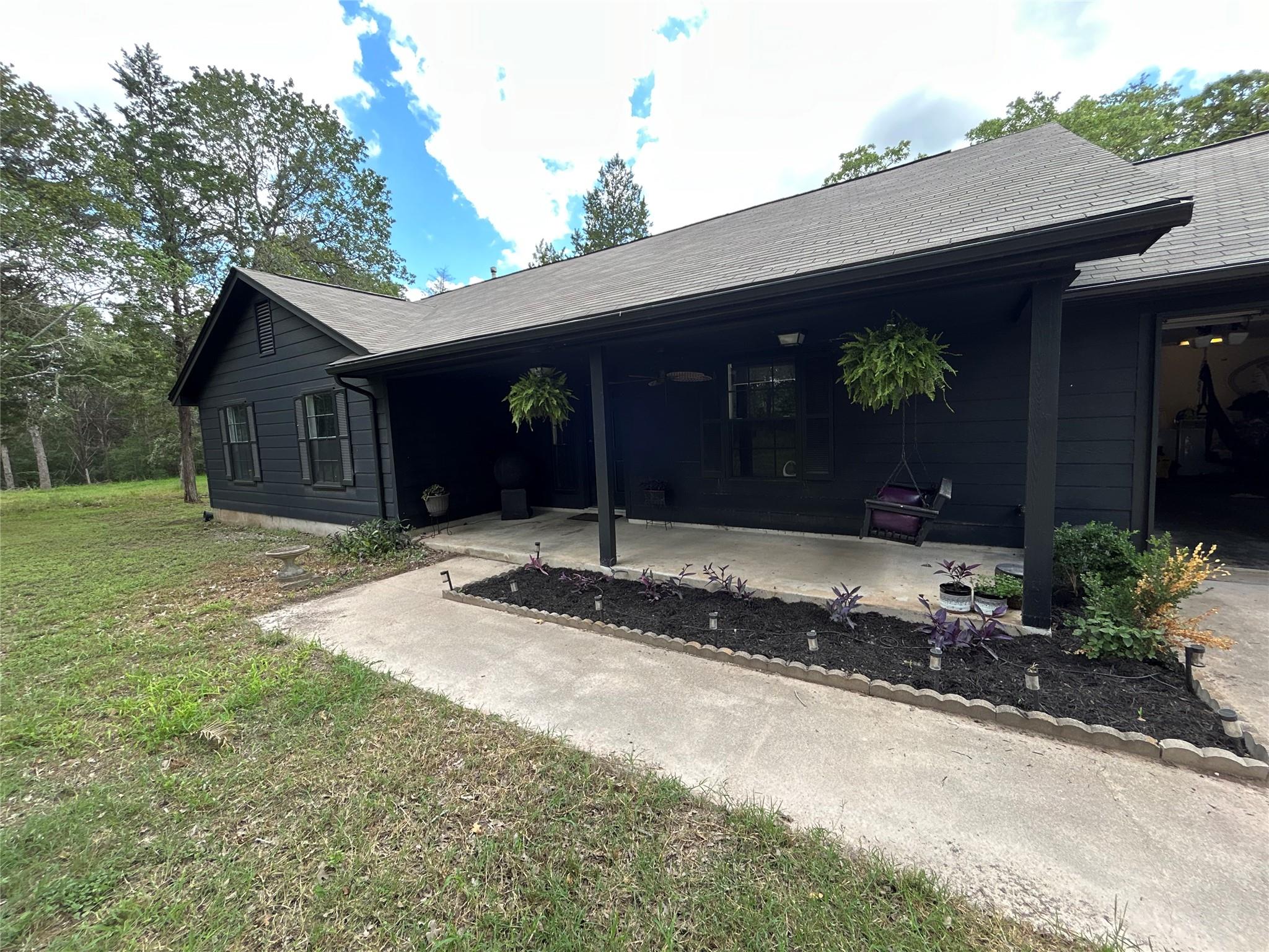 An inviting front entrance with a welcoming cover