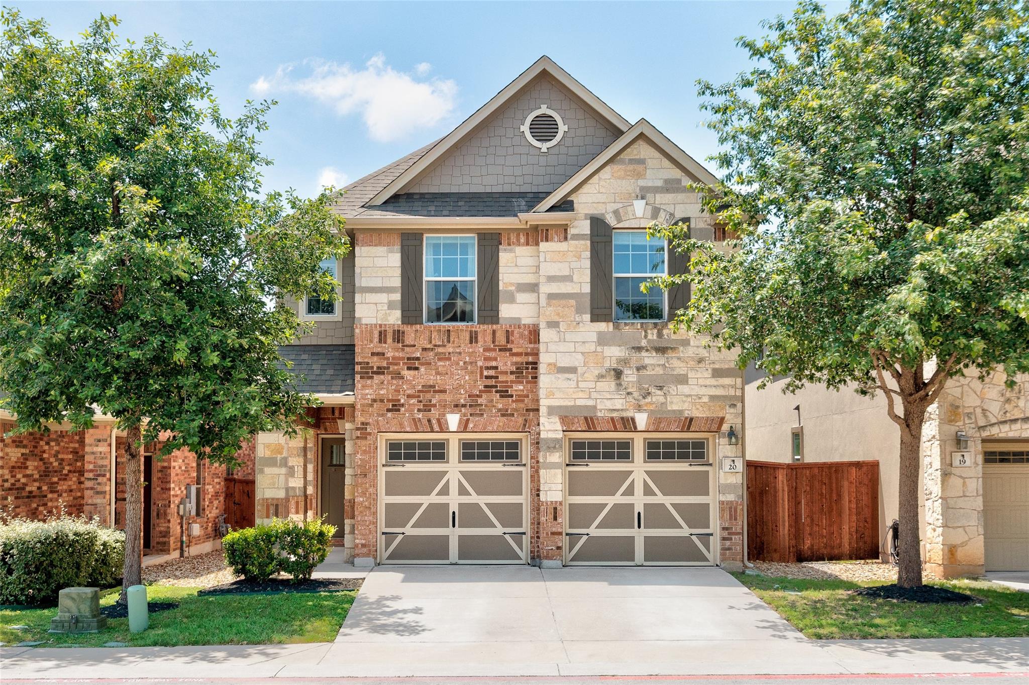 A charming facade of brick and stone greets visit
