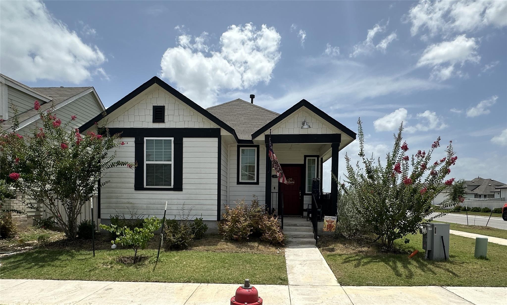 A charming single-family residence with a welcomi