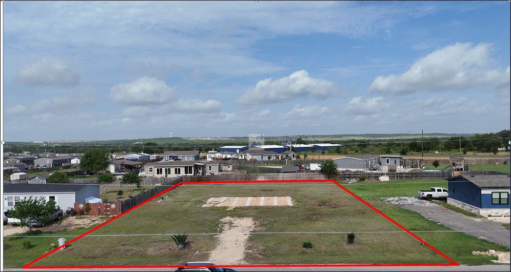 A spacious, buildable lot awaits your vision amid