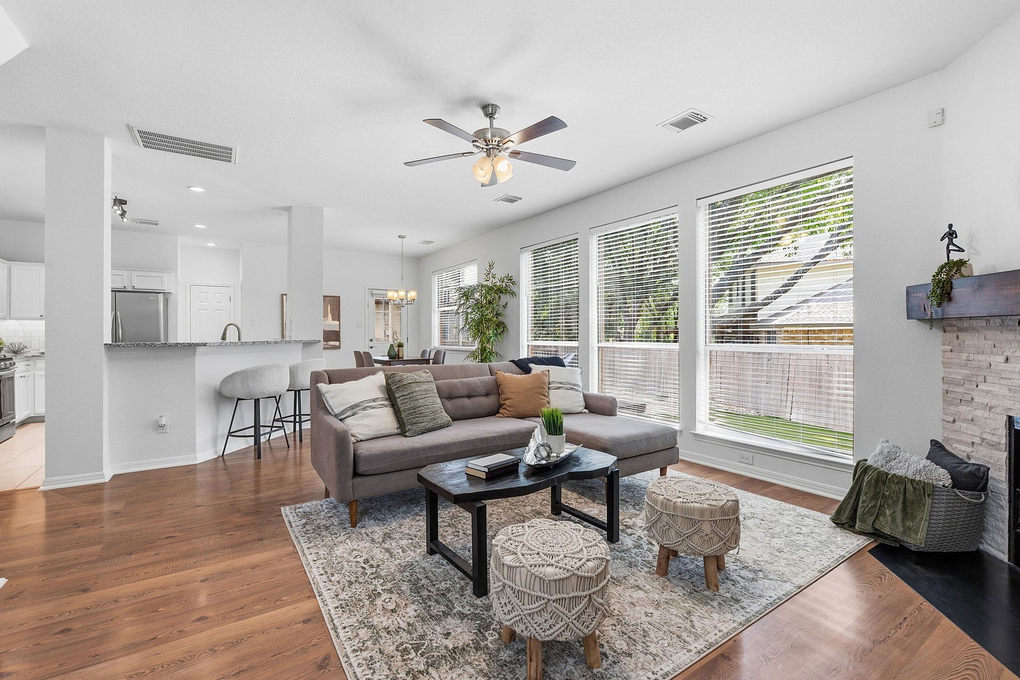 An open-concept living space integrates a well-li