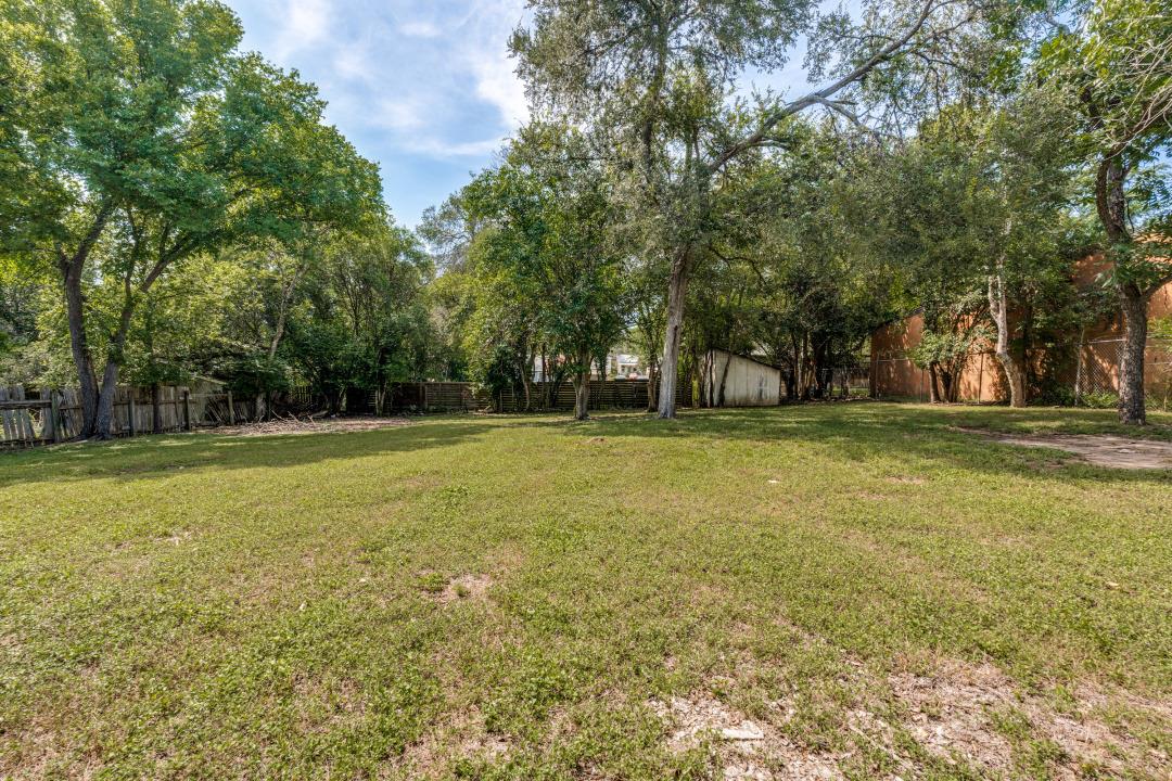 A spacious lot with established trees and natural