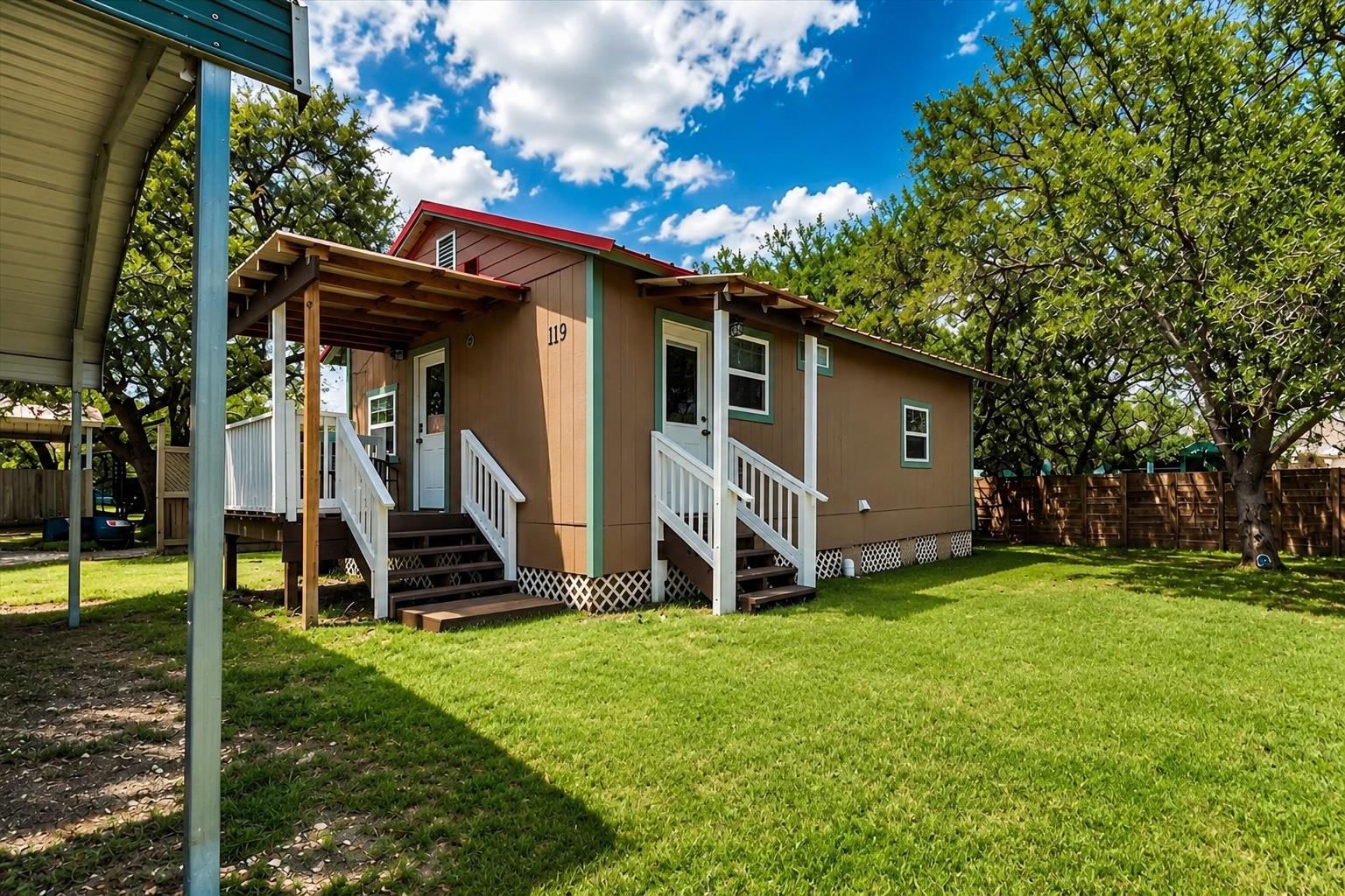 A welcoming front porch leads into this charming 