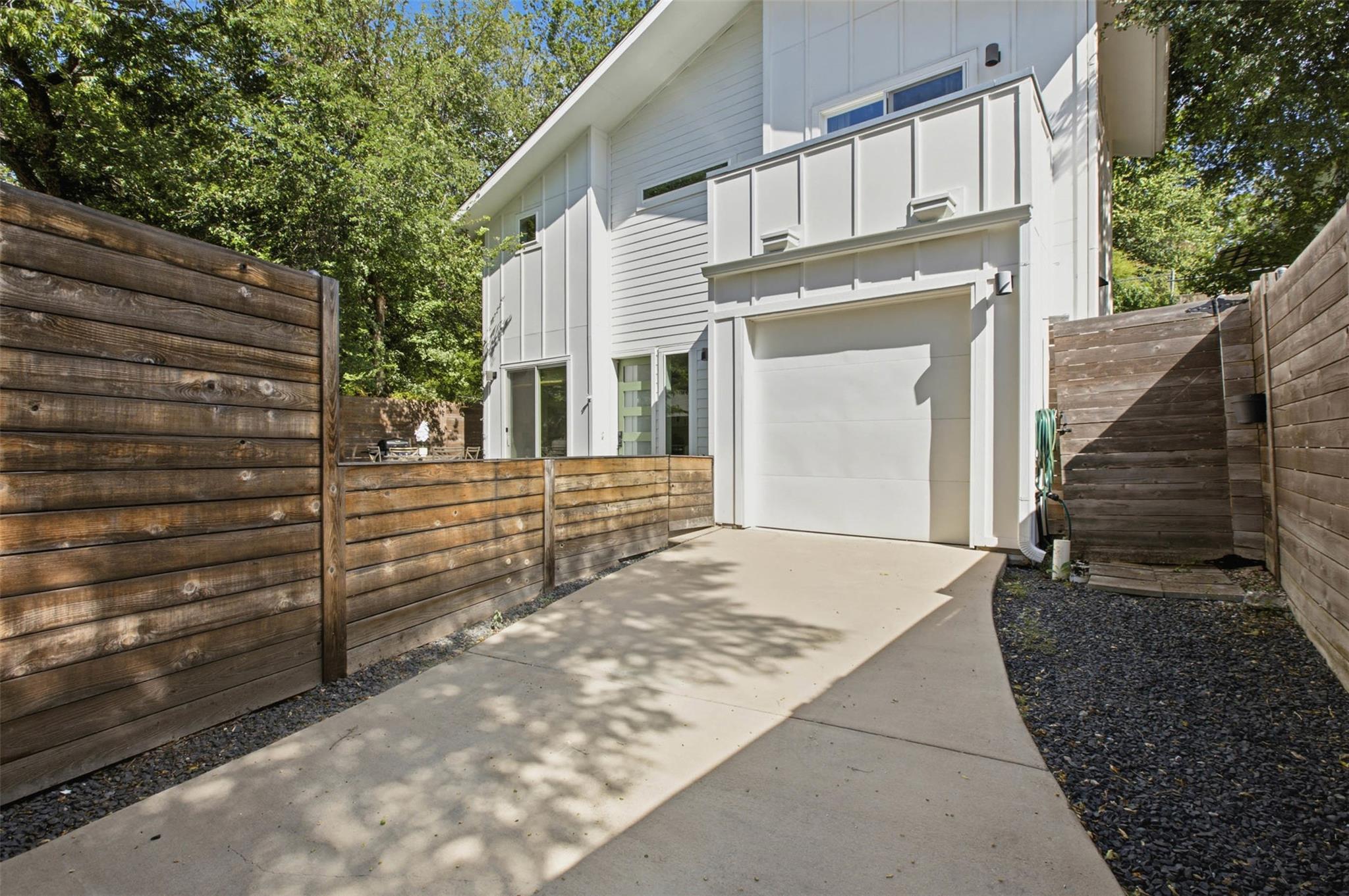 A private driveway leads to a contemporary reside