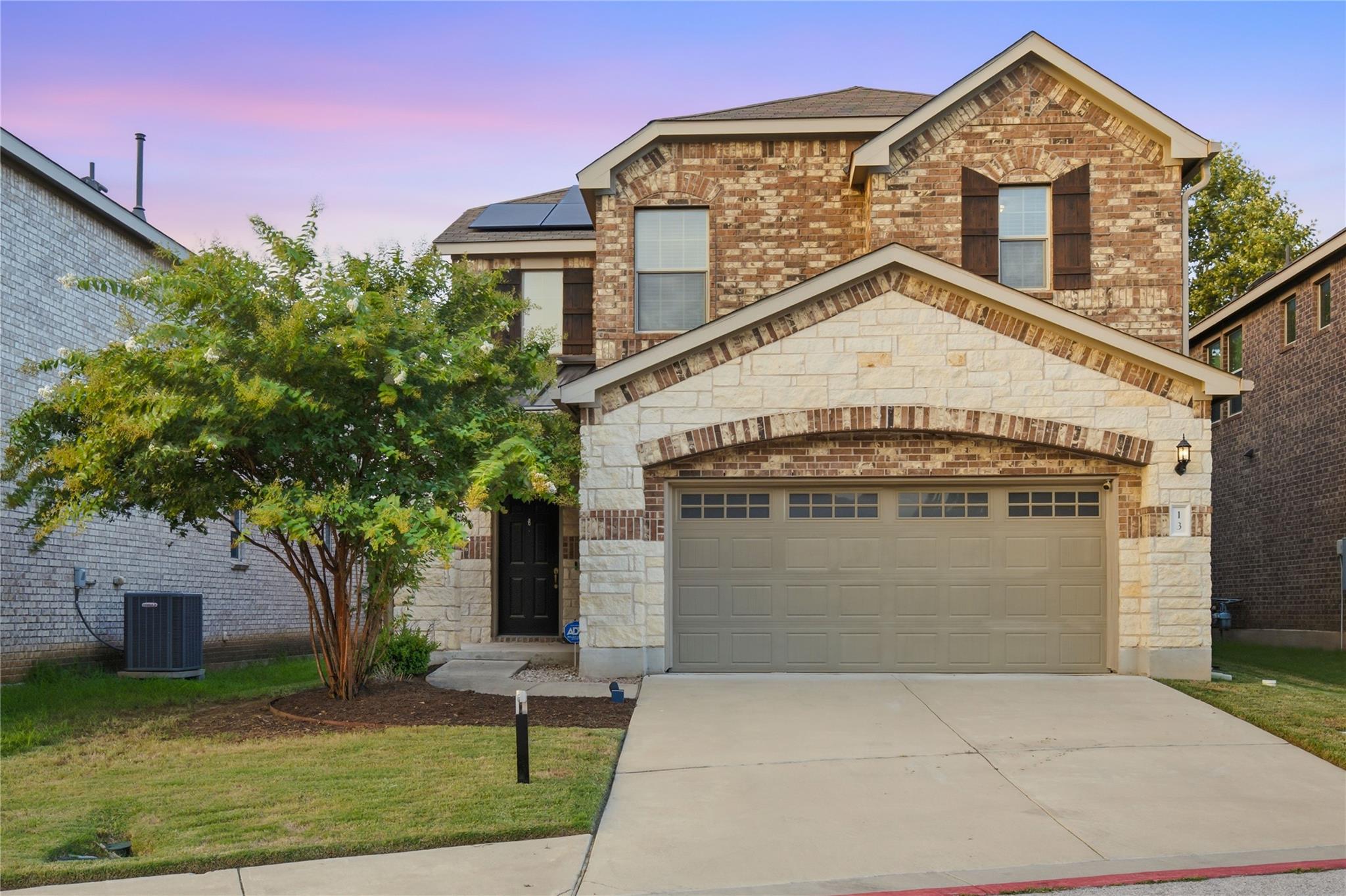 A charming two-story home with a harmonious brick