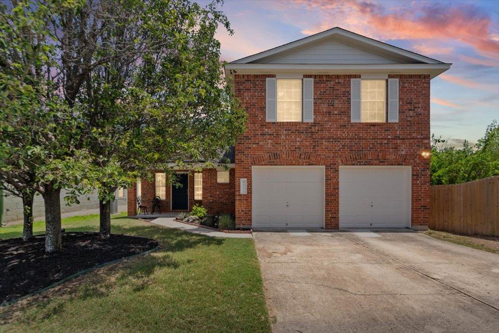 A well-maintained brick exterior with attached ga