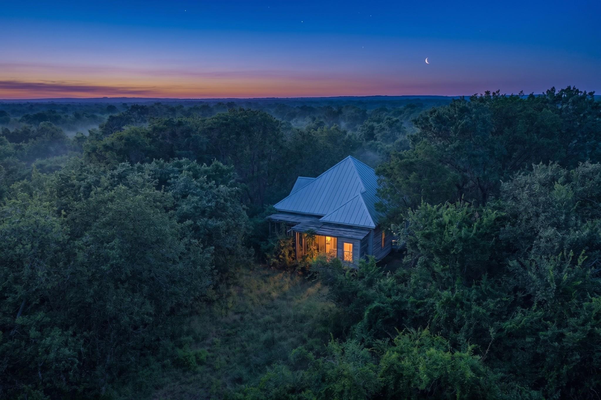 An enchanting, secluded home nestled in a dense f