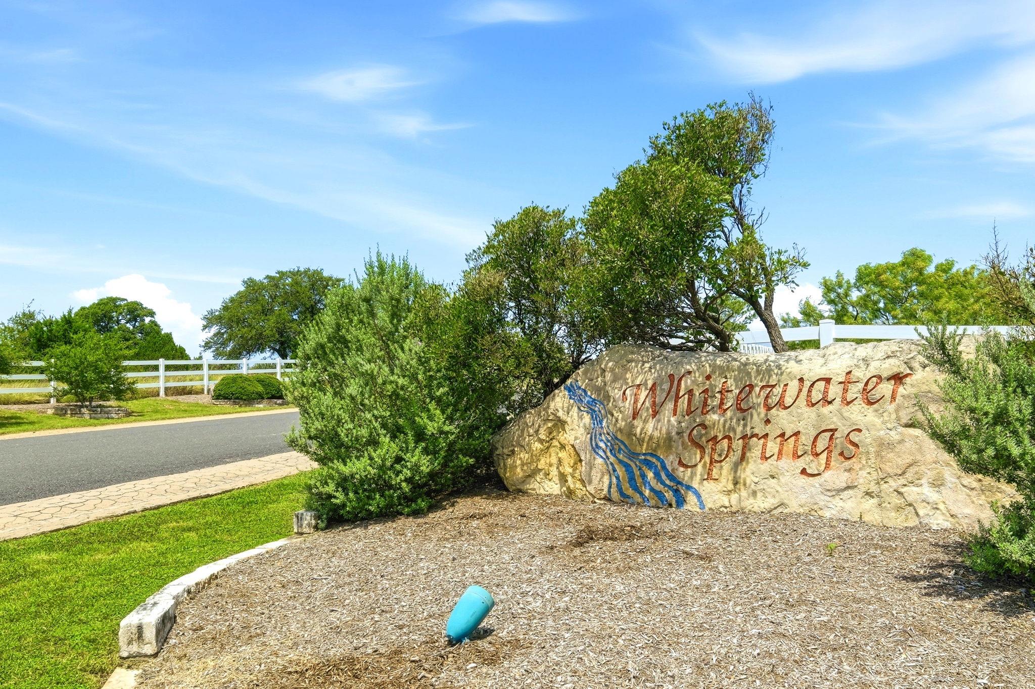 A welcoming stone monument marks the entrance to 