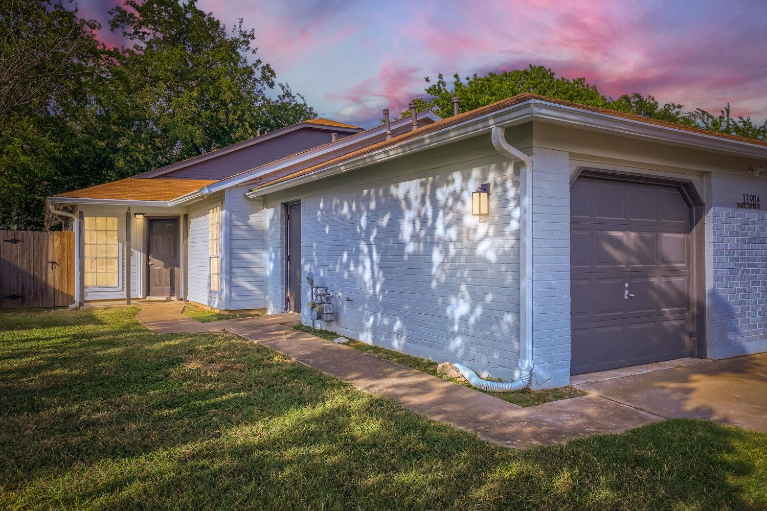 A classic facade with a single garage door offers