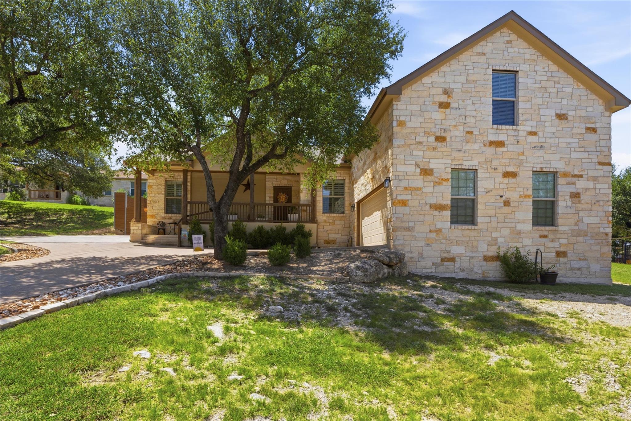 A stone-clad residence with a welcoming front por