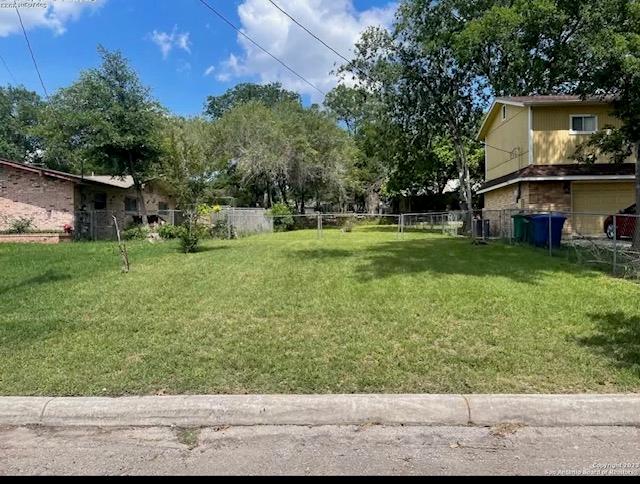 A well-maintained, clear residential lot presents