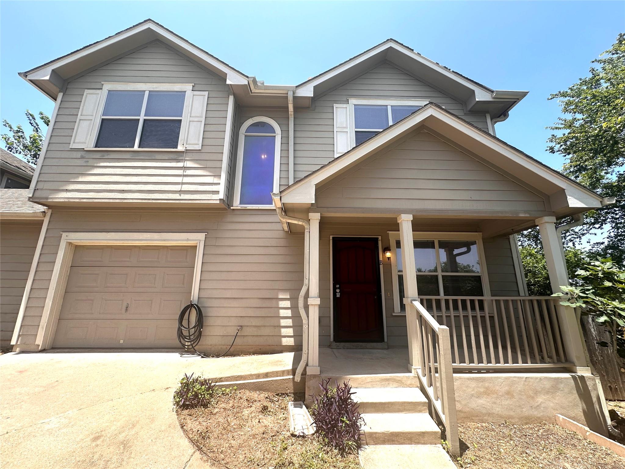 A welcoming front porch enhances this charming re