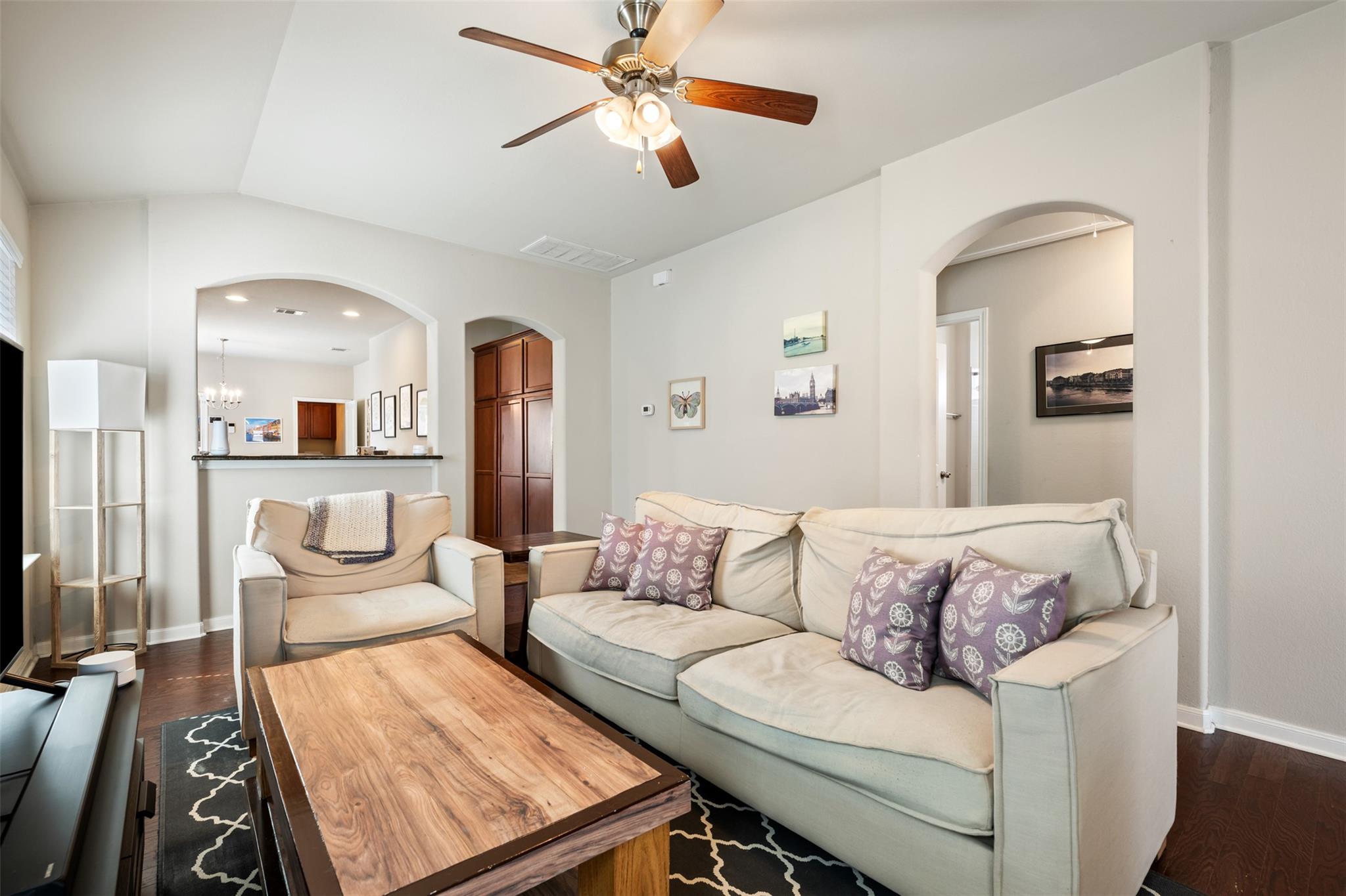 A comfortable living space featuring hardwood flo
