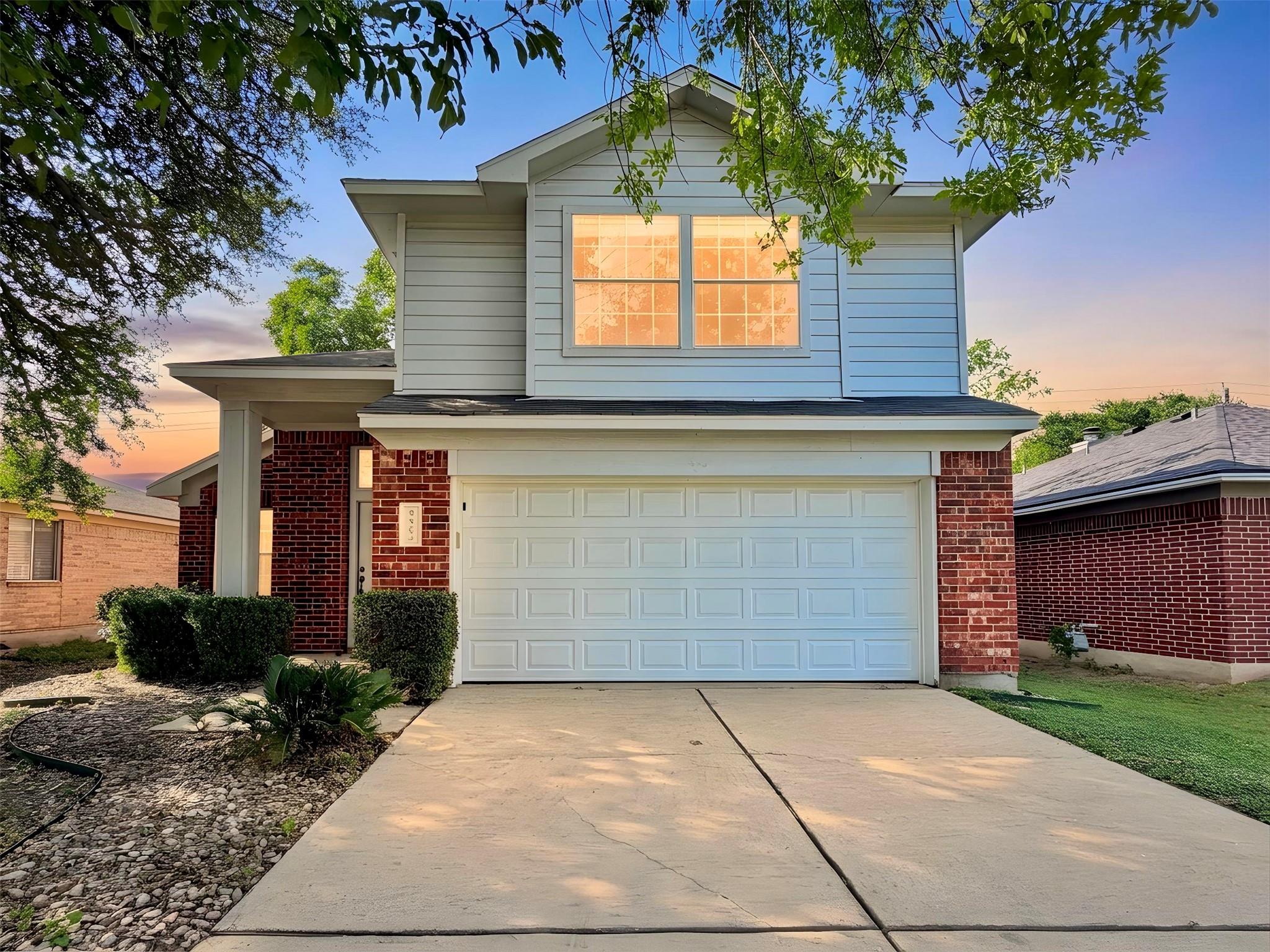 A welcoming facade showcases a combination of bri