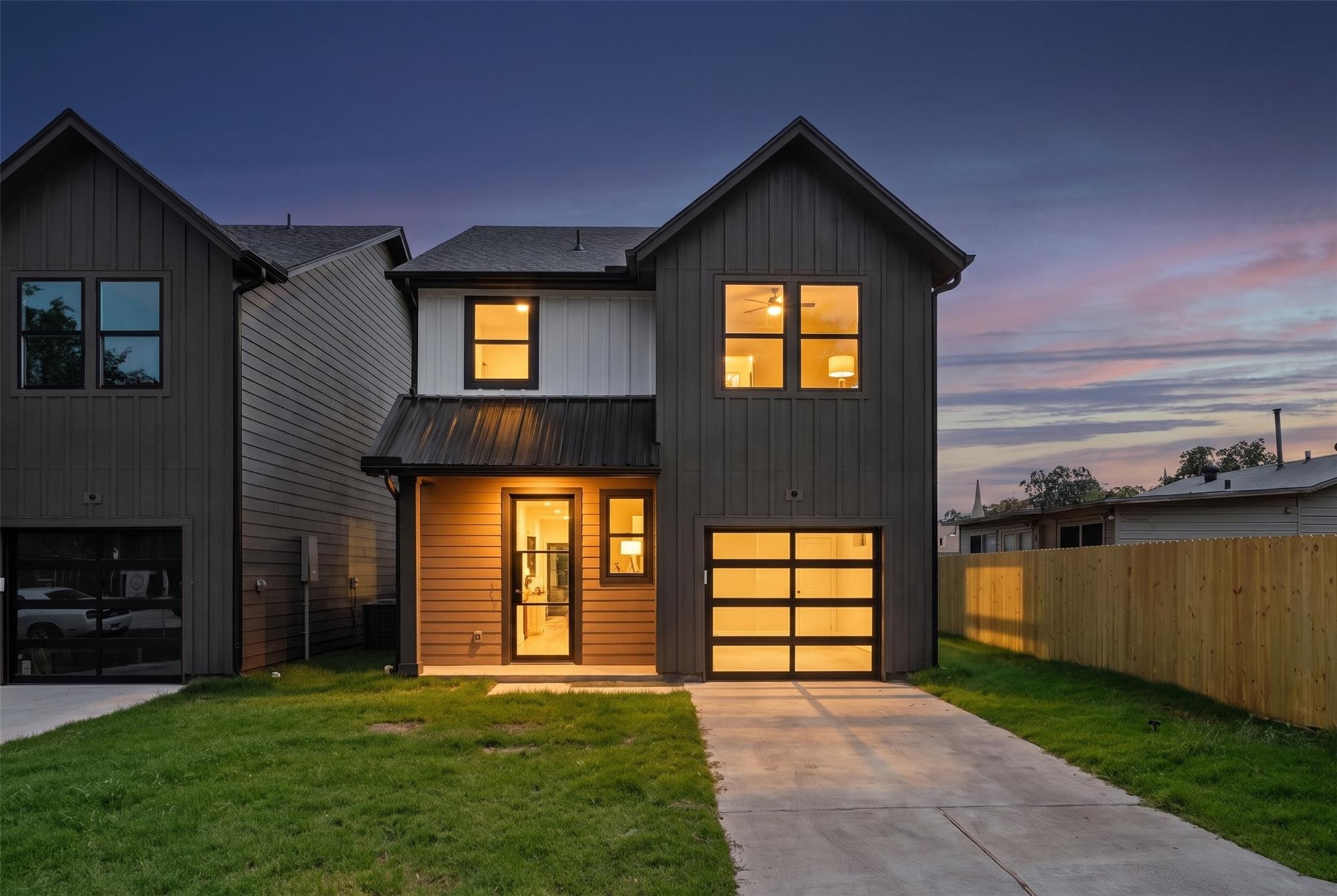 A striking modern facade with a well-lit entrance