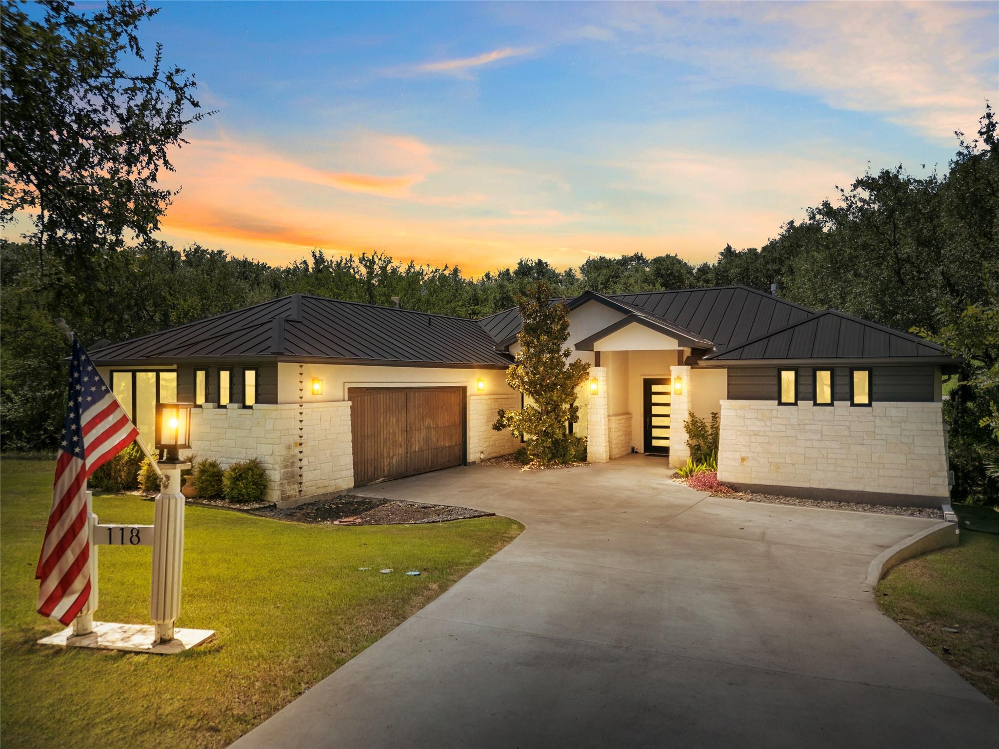 A graceful home with a modern roofline sits nestl
