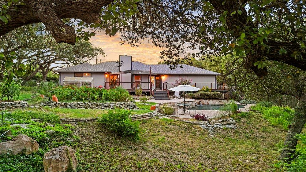 A tranquil backyard oasis featuring a lush garden