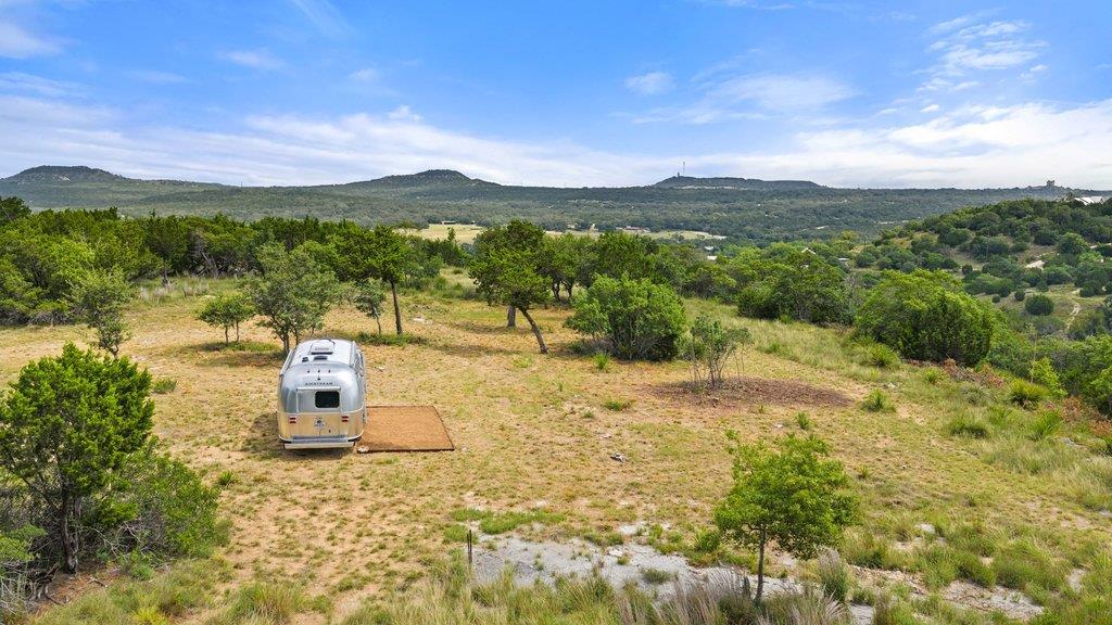 A sprawling lot offers panoramic hill country vie