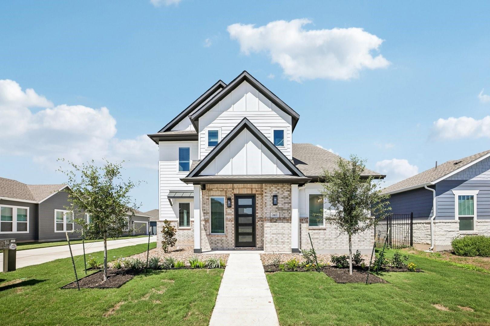A modern facade with striking gables and mixed-ma