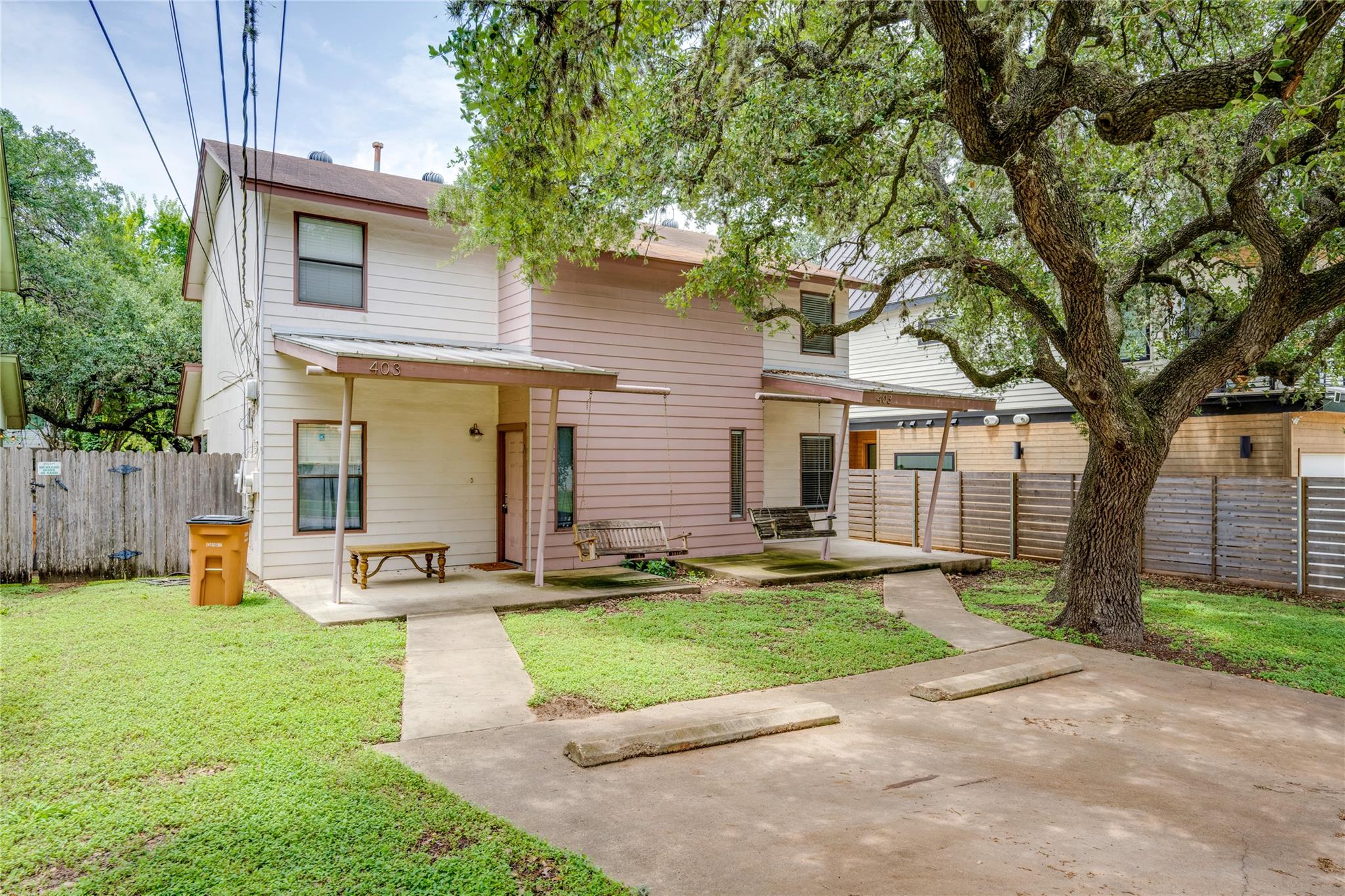 Mature trees and inviting porches enhance the cha
