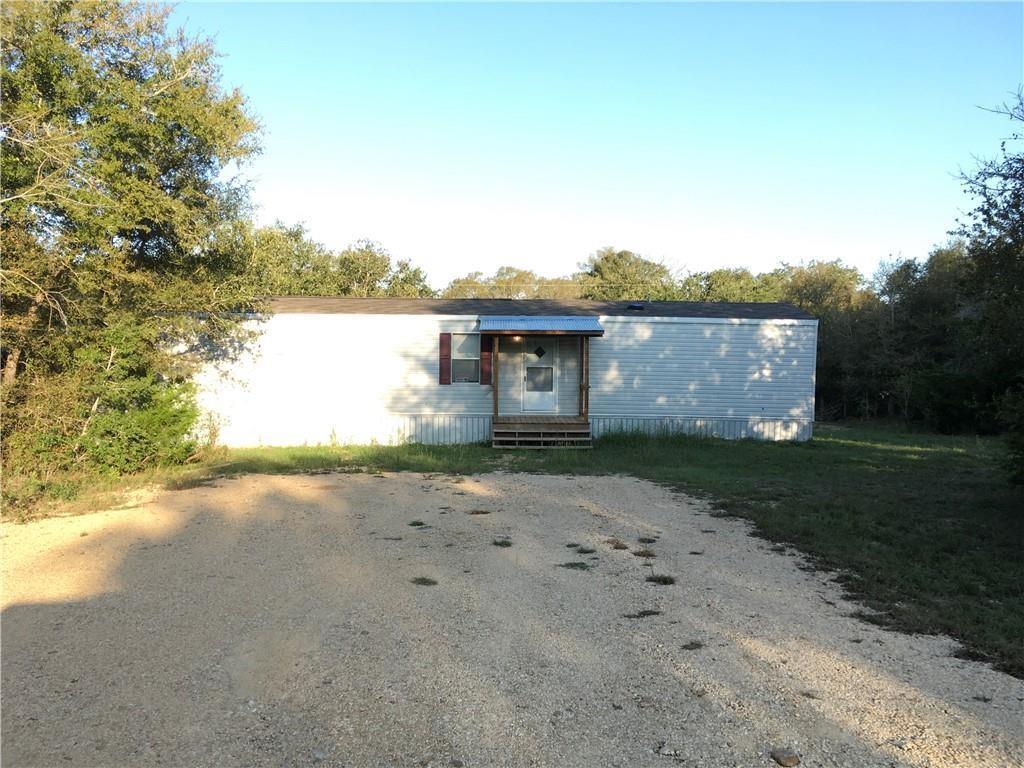 Manufactured / mobile home with gravel driveway