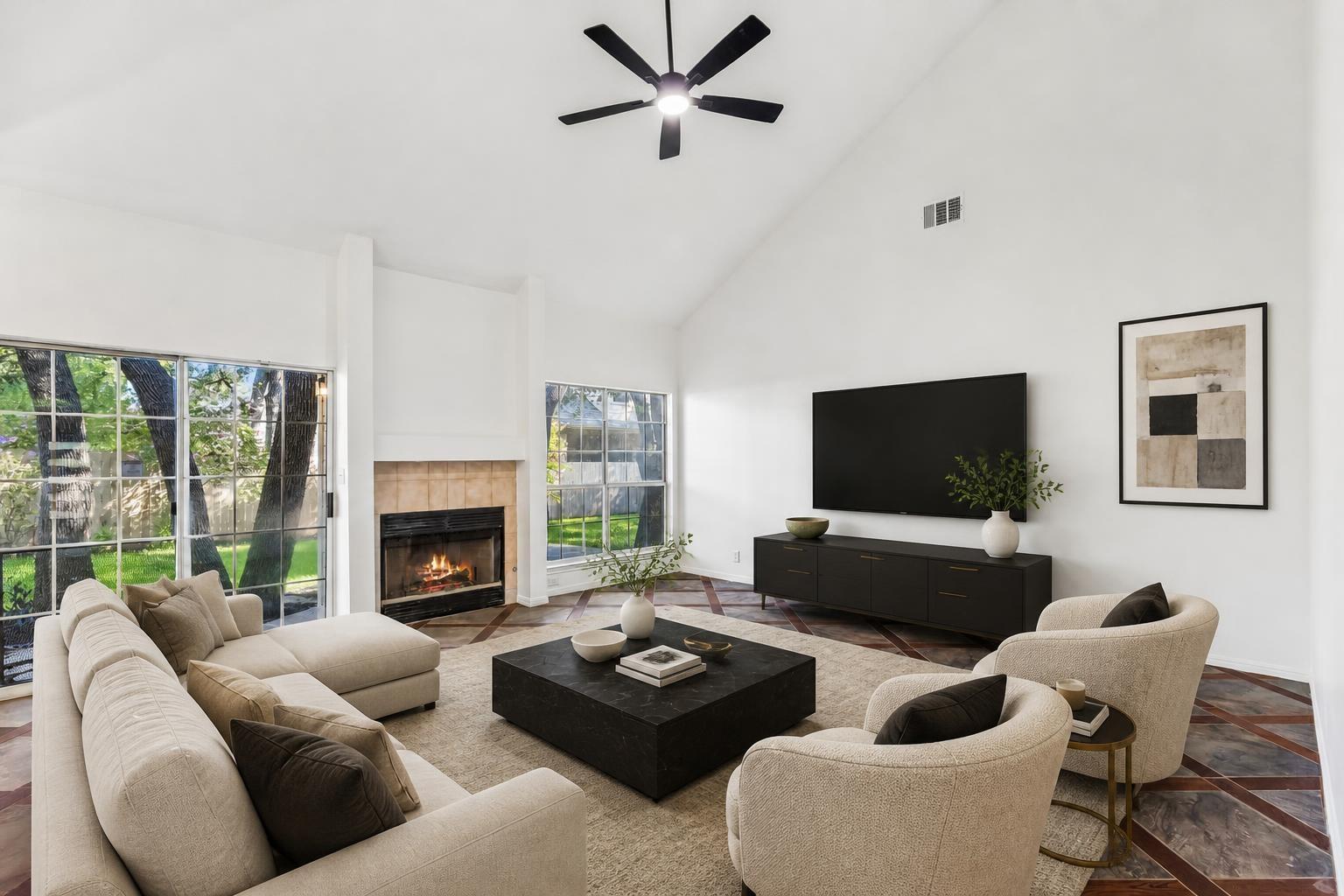 High vaulted ceilings and a classic fireplace def