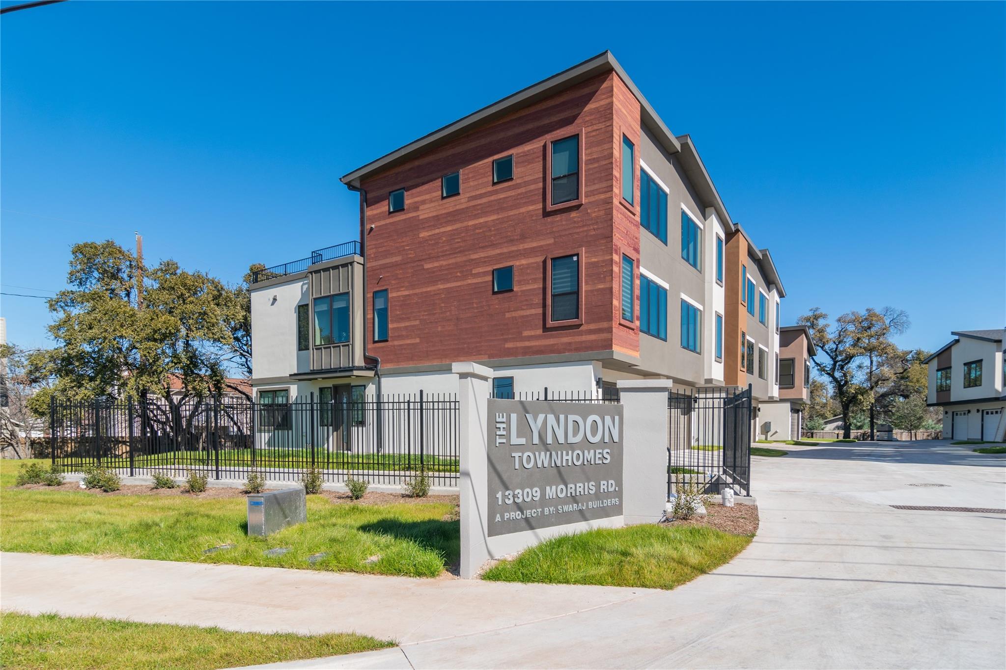 Contemporary multi-story townhomes with wood and 