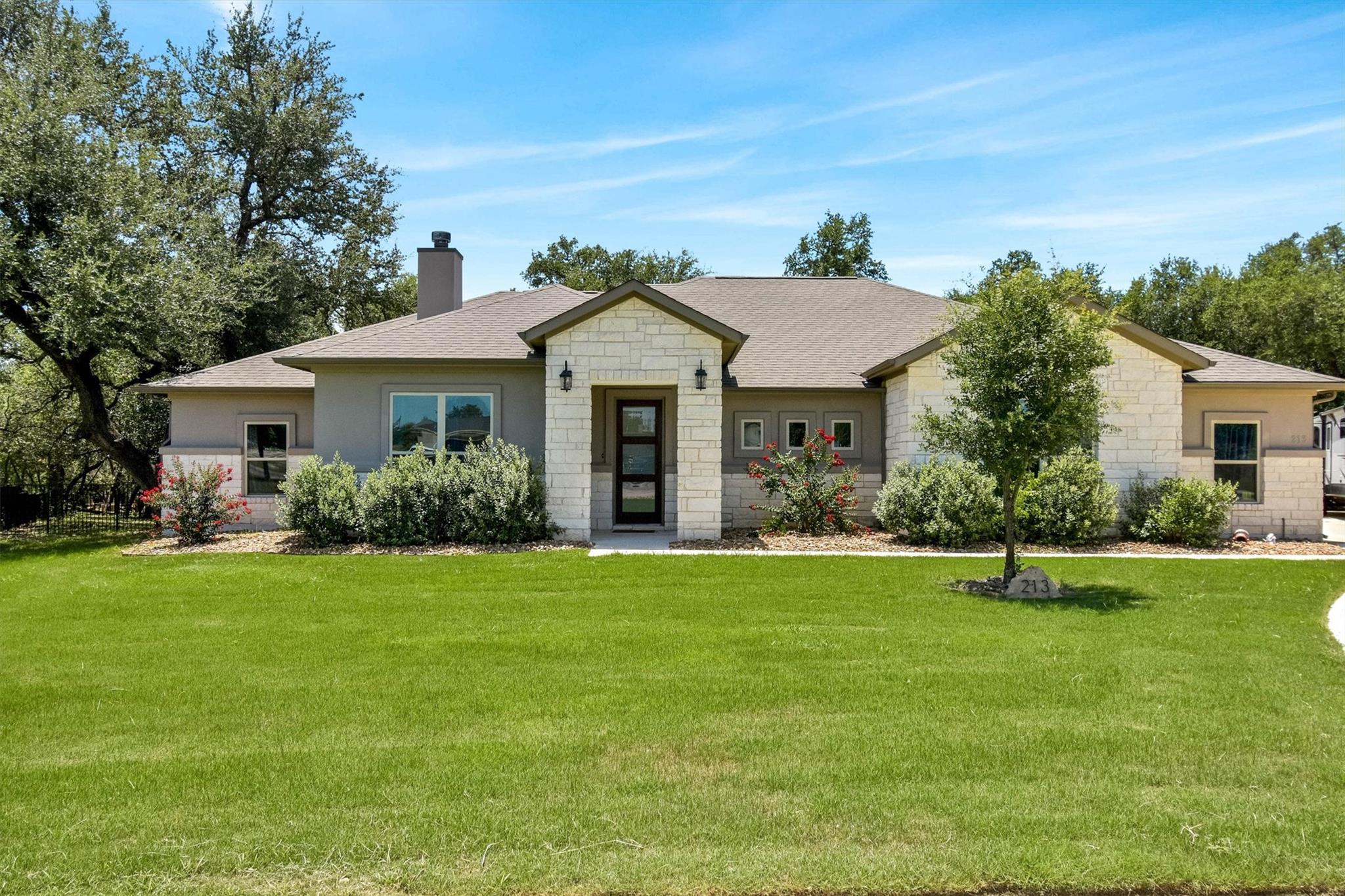 A striking modern ranch-style home, accented with