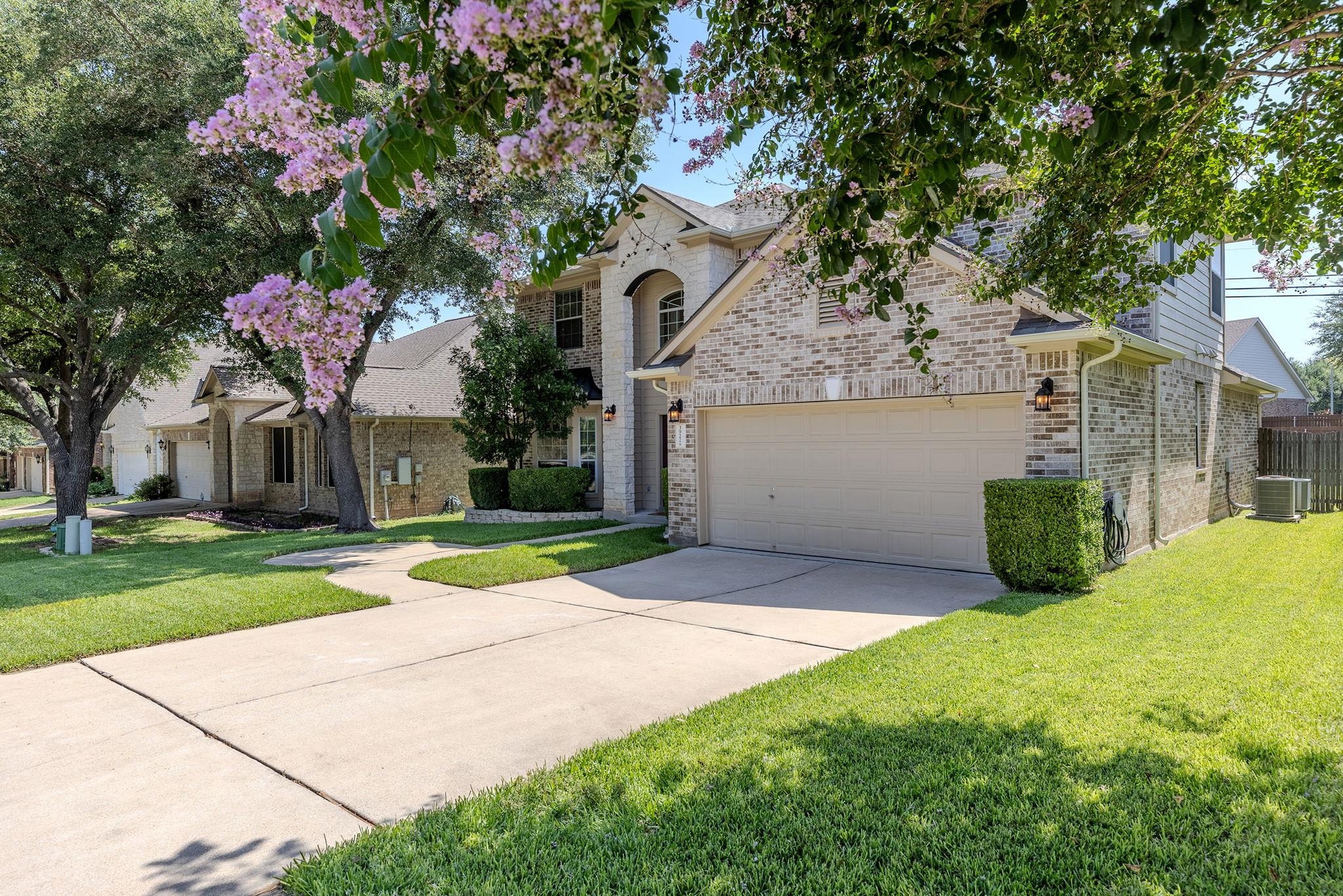 A classic brick exterior with a two-car garage we