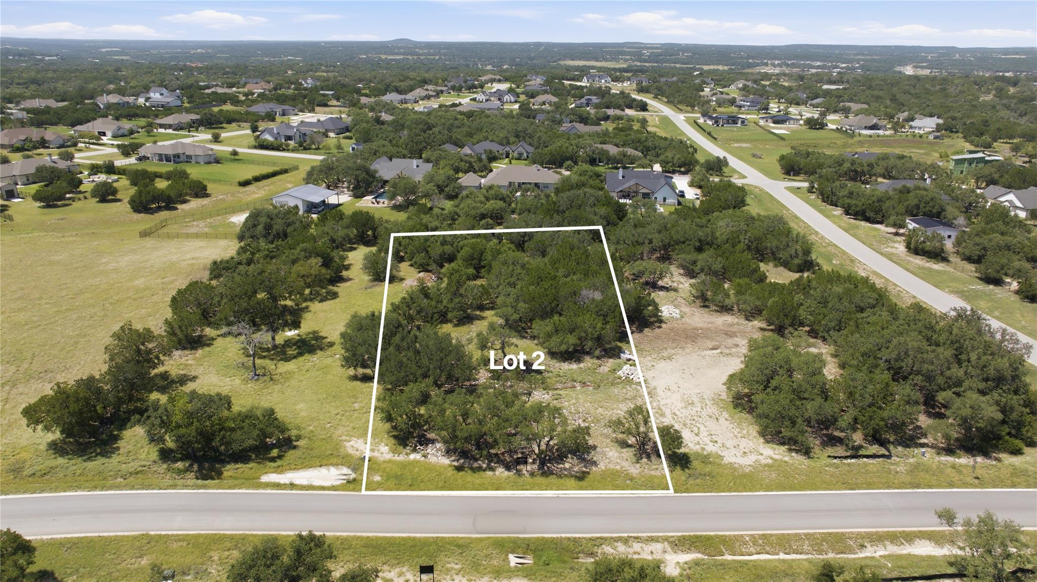 A generously sized lot featuring mature trees, pe