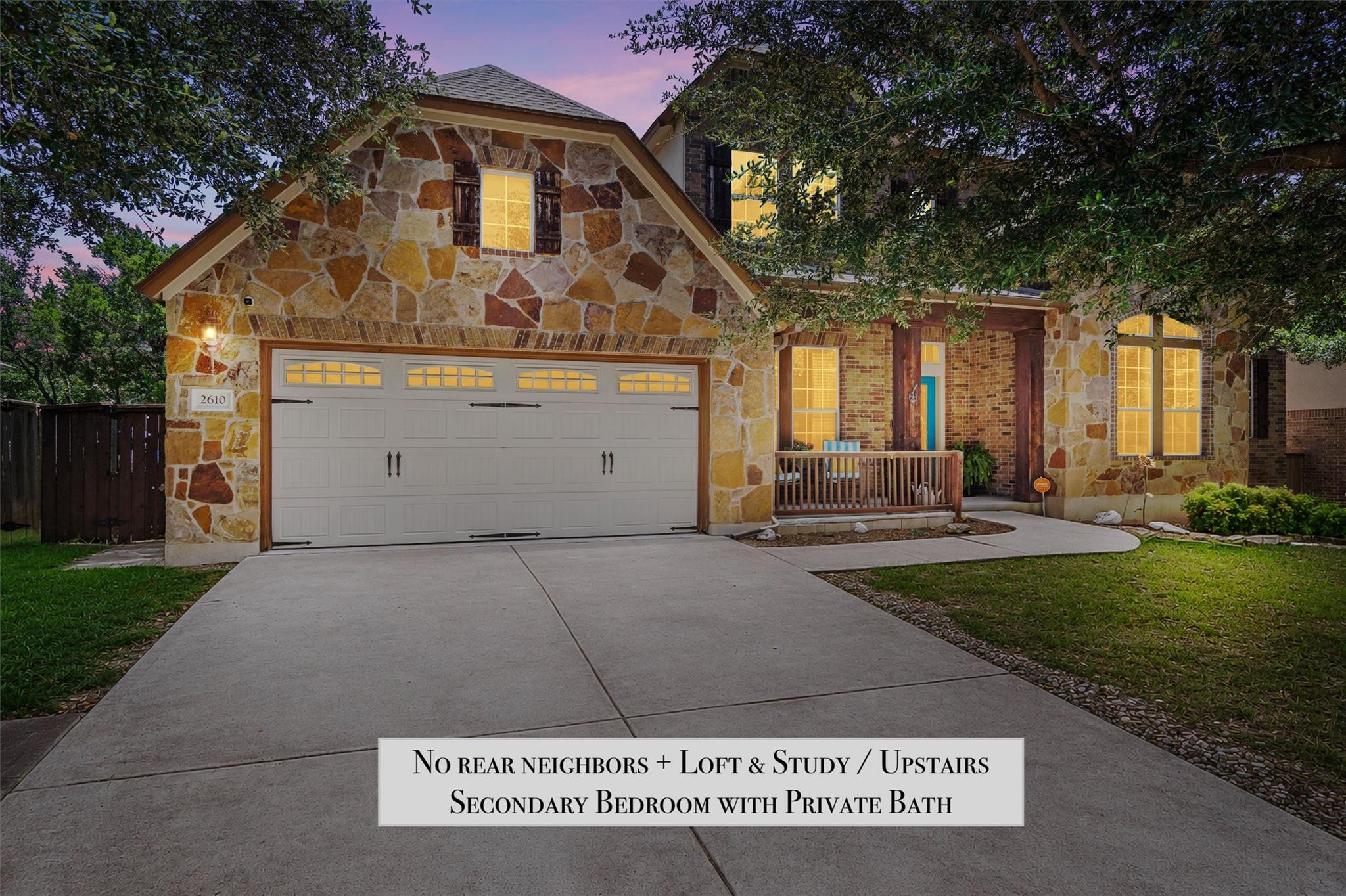 Stone and brick facade home with a welcoming fron