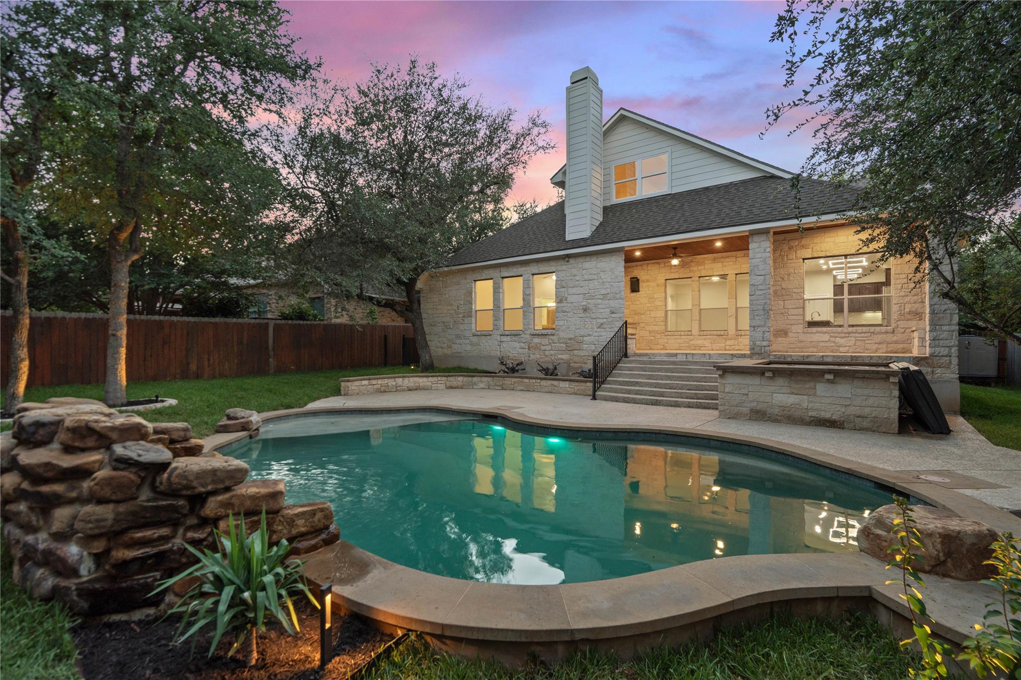 An inviting backyard oasis awaits with a sparklin