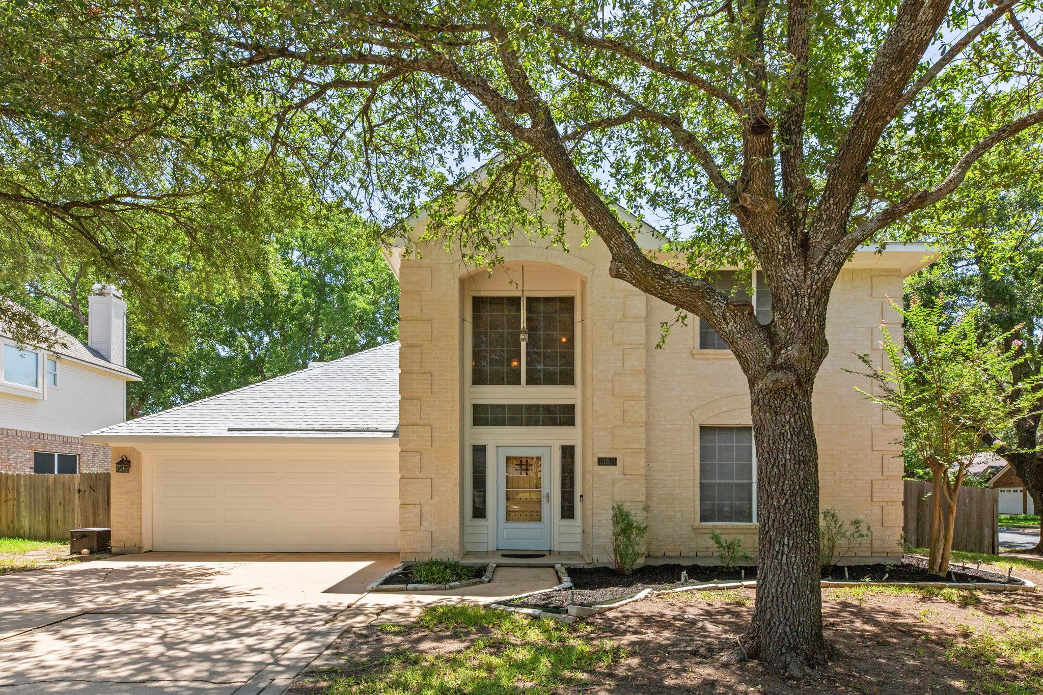 A well-maintained facade with an attached garage 