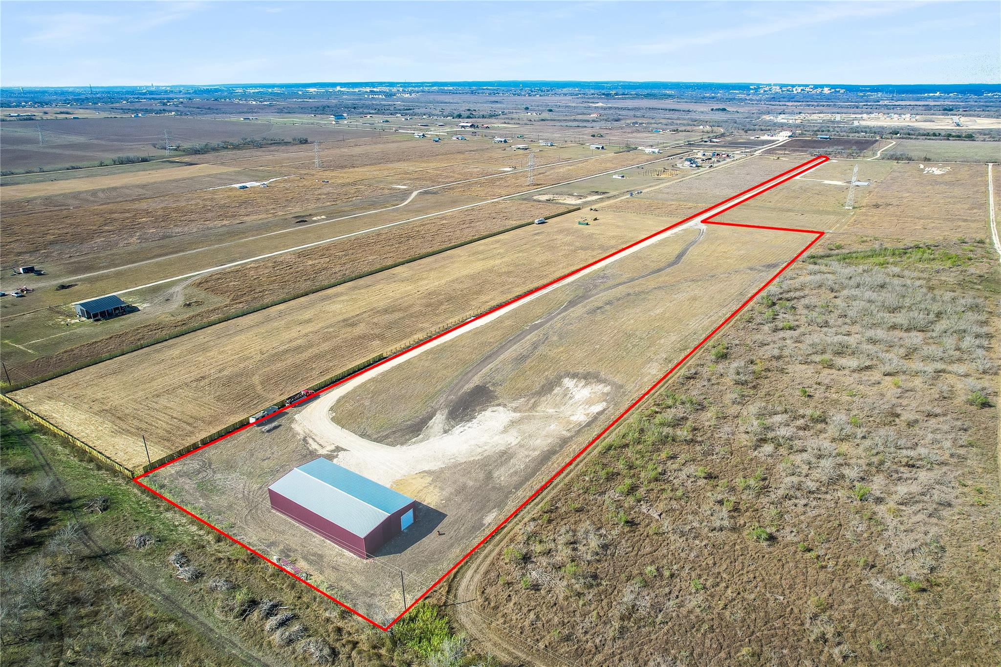 An aerial perspective reveals a vast, open parcel