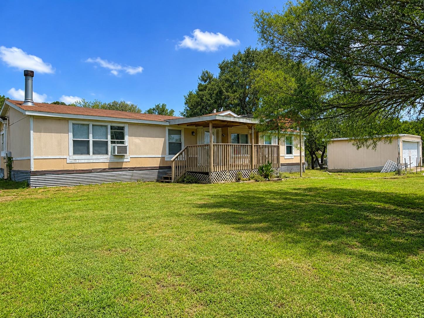 A welcoming front porch leads to this charming re
