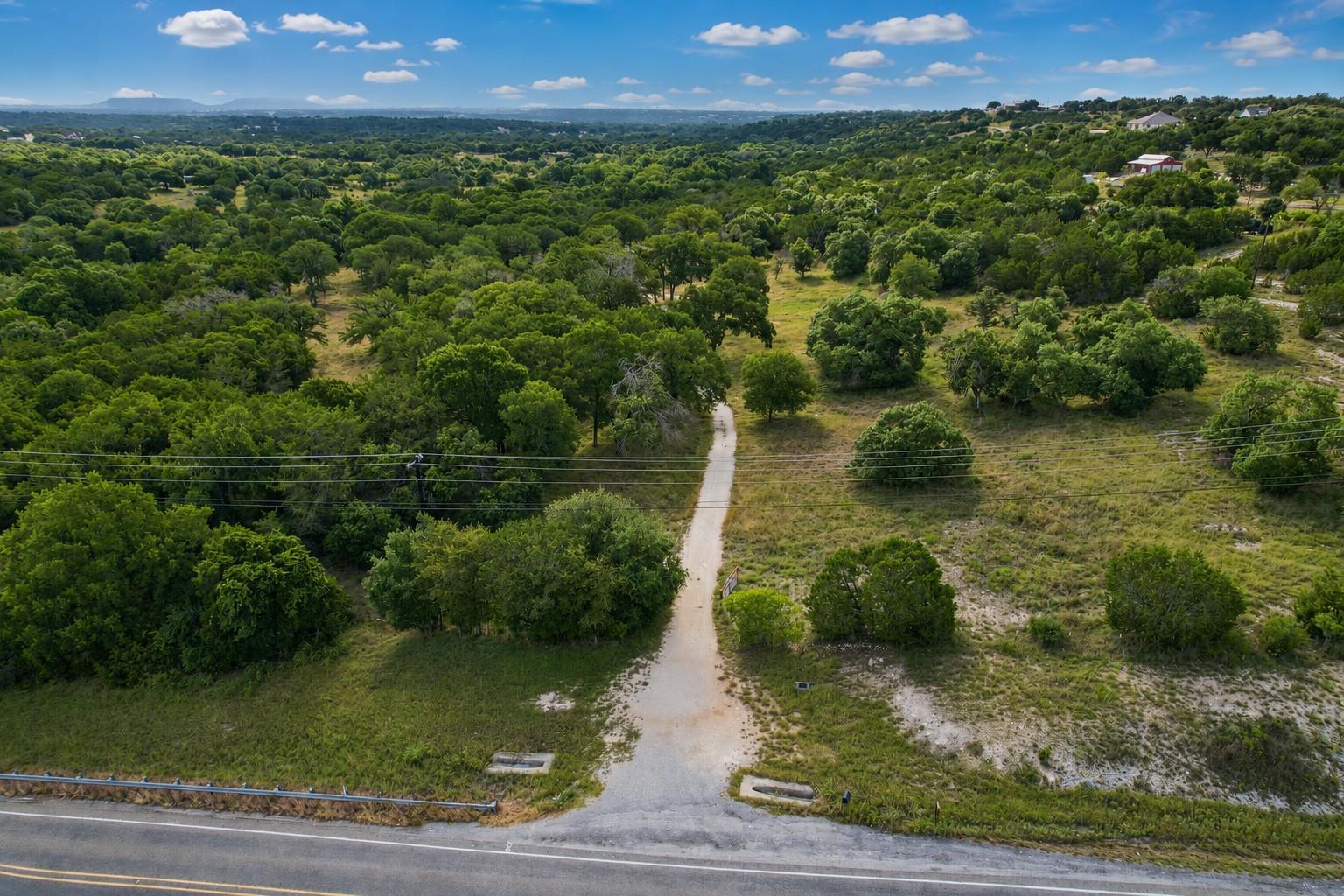 A tranquil, tree-filled landscape offers a privat