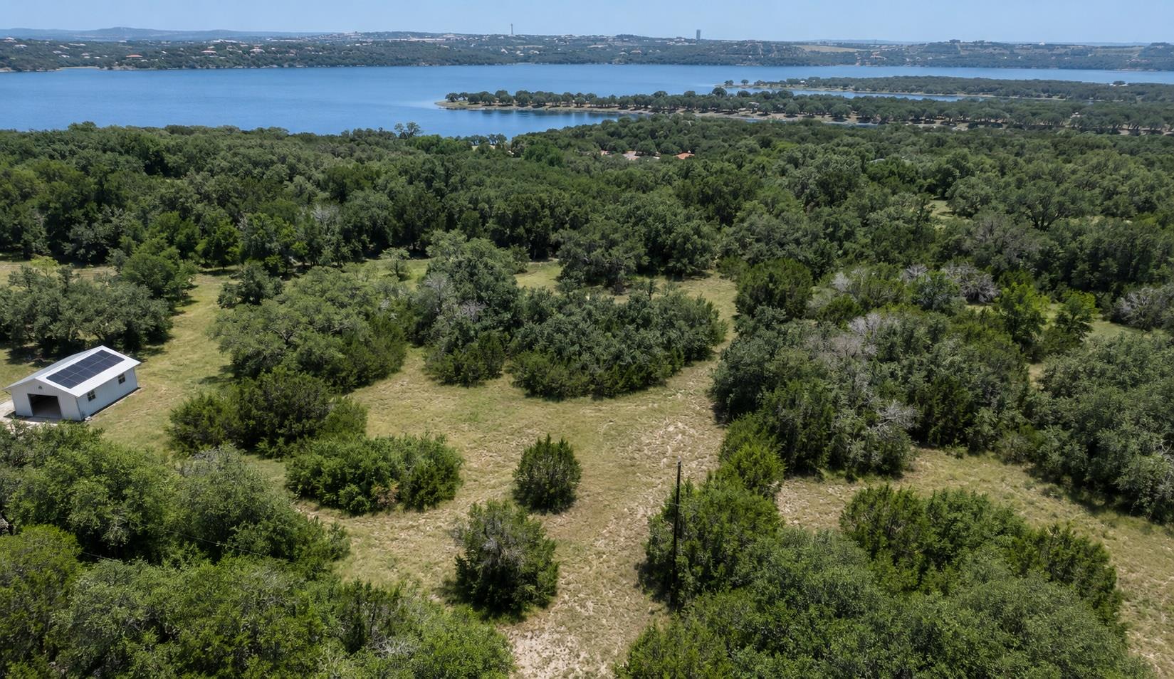 A sprawling, wooded landscape with a clear view o