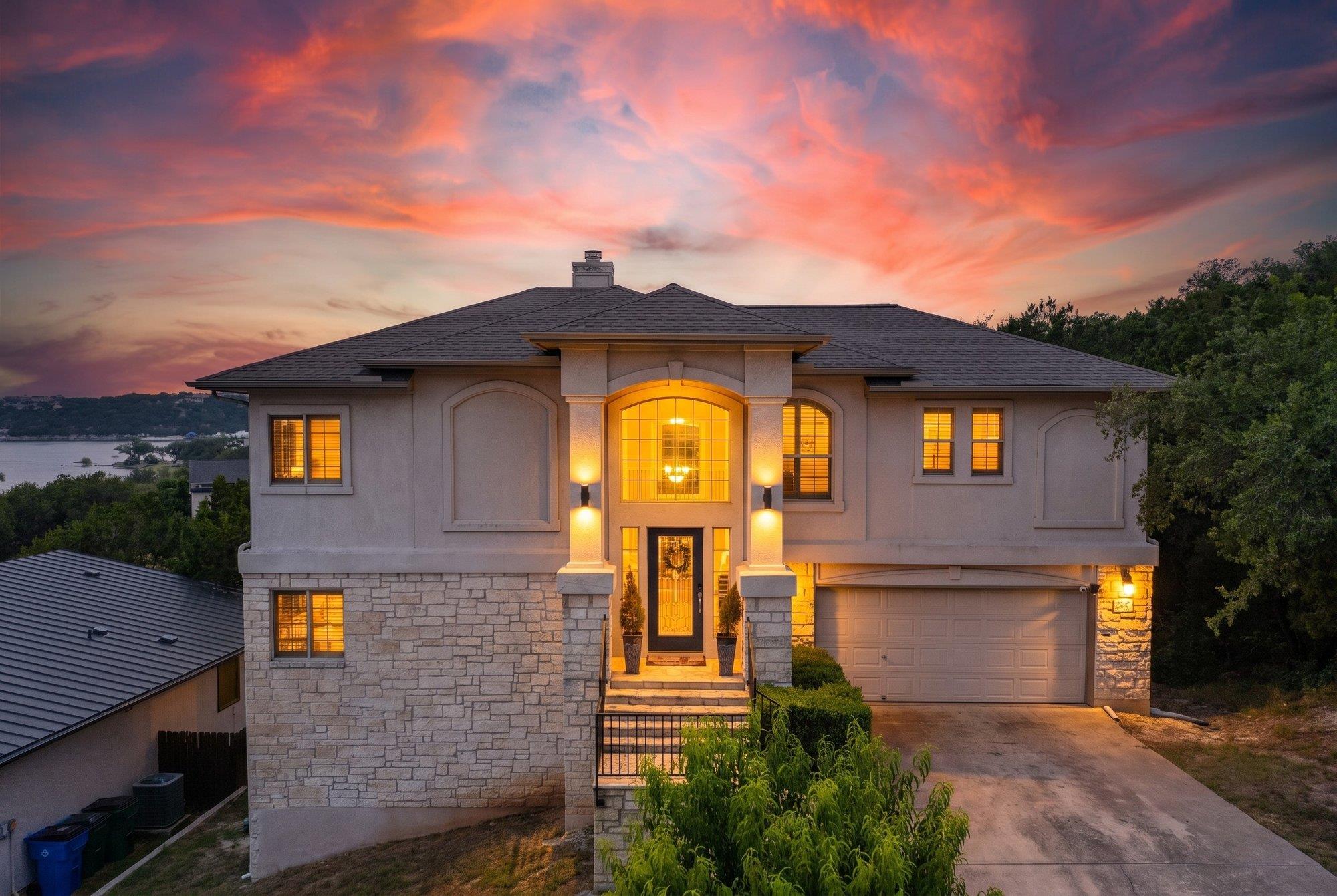 Dramatic sunset hues illuminate the stately stucc