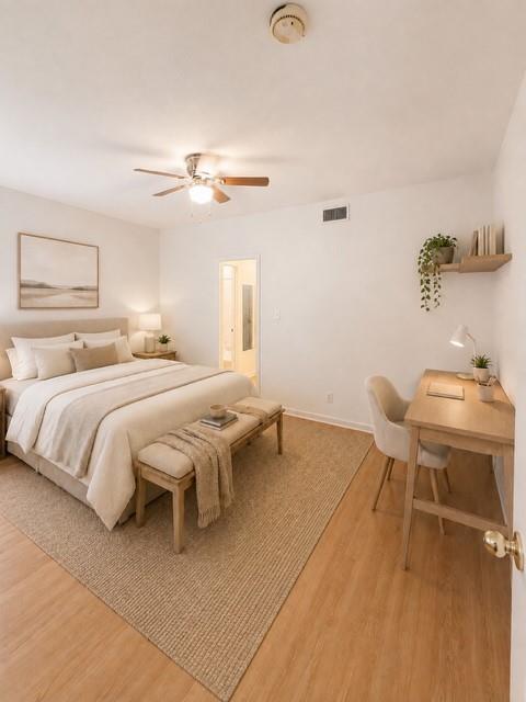 A tranquil sleeping space features a ceiling fan,