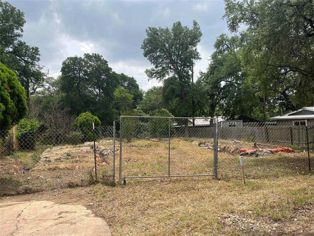A promising build site awaits with mature trees d