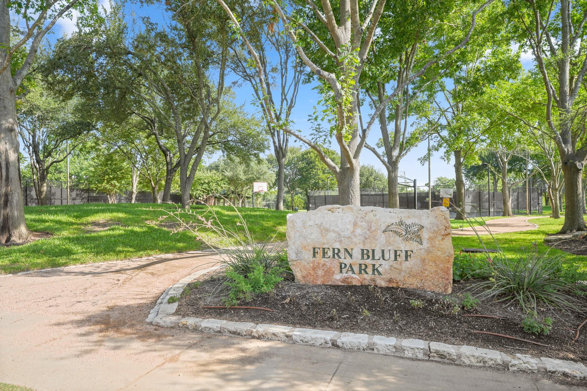 A natural stone monument marks the entrance to Fe