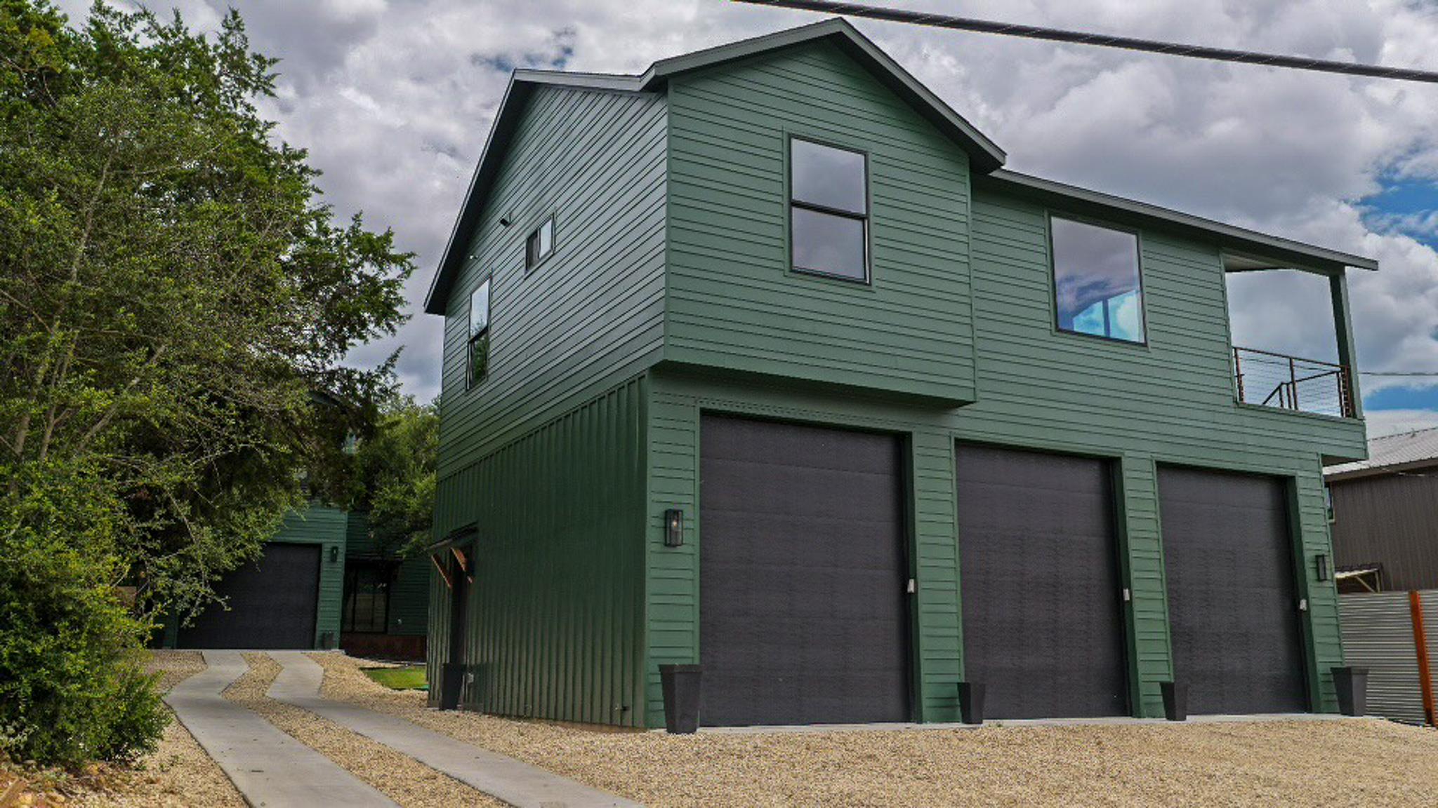 Bold green siding adorns this contemporary reside